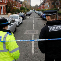 Police officers stood at a crime scene