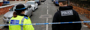 Police officers stood at a crime scene